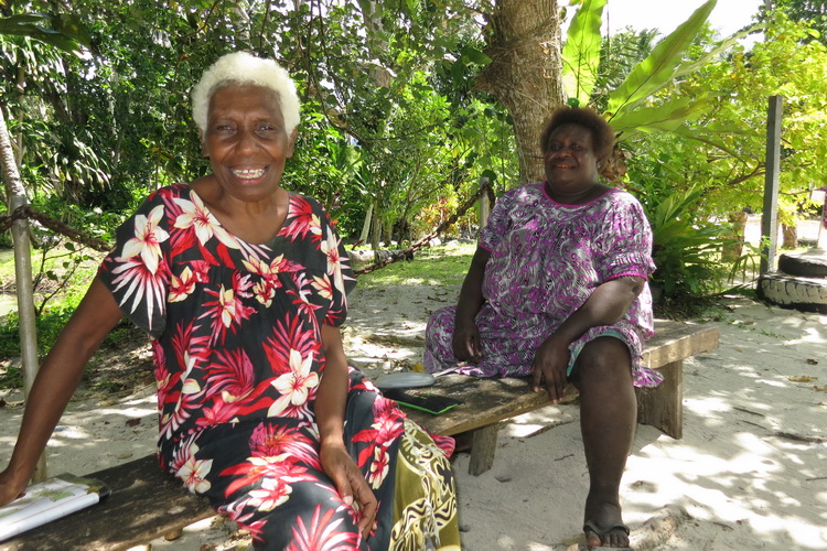 Cathy's Eels - Cathy Hiob (left) and her eel feeding assistant